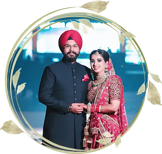 Sikh wedding couple portrait with the groom in a red turban and the bride in traditional red bridal attire